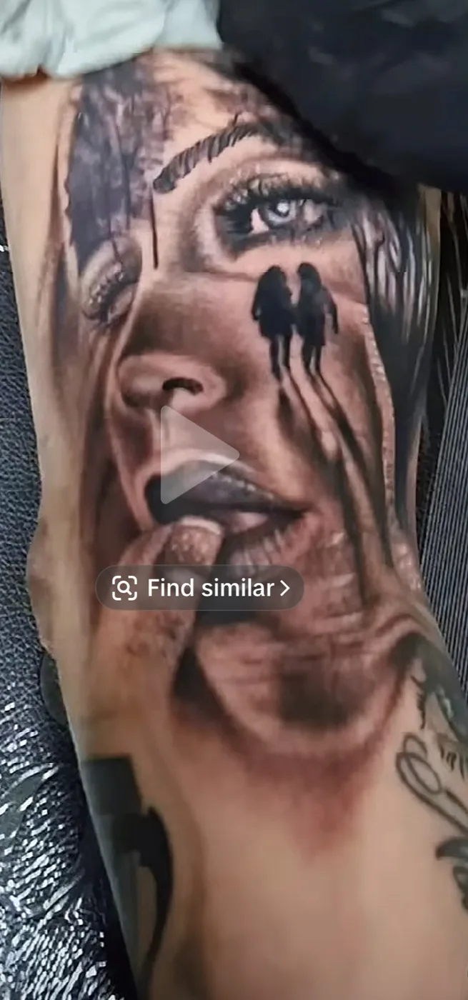 Black and gray portrait tattoo